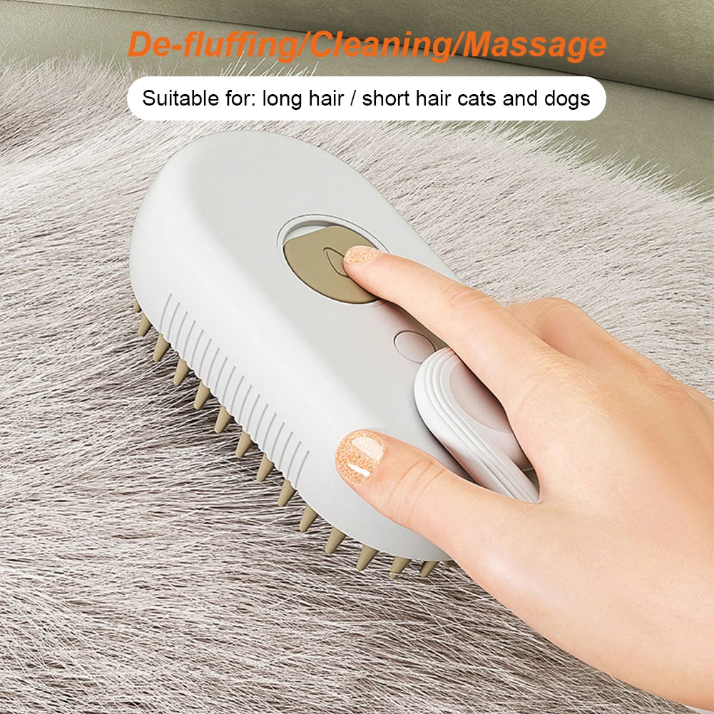 Orange and white 3-in-1 steam pet grooming brush with ergonomic handle