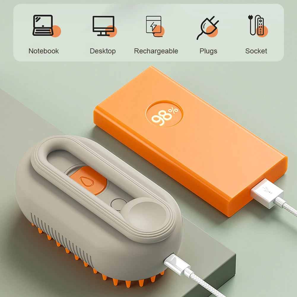 Orange and white 3-in-1 steam pet grooming brush with ergonomic handle